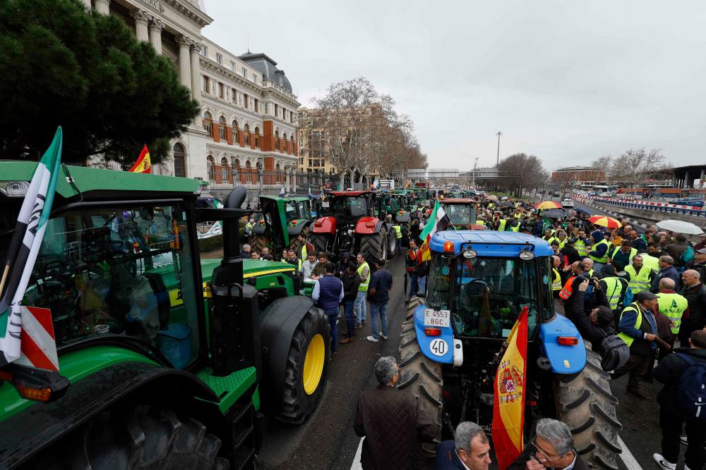 Tractors block off a street in front of the Agriculture Ministry during a farmers protest on their conditions and the European agricultural policy, in Madrid on February 15, 2024/AFPPix