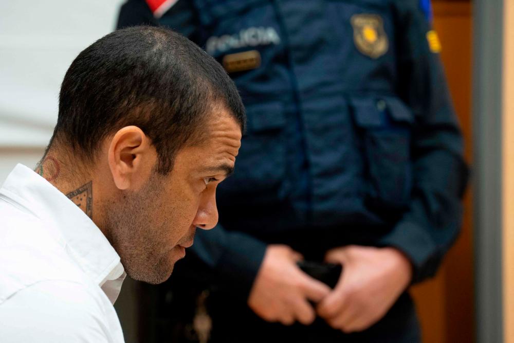 Brazilian footballer Dani Alves looks on at the start of his trial at the High Court of Justice of Catalonia in Barcelona, on February 5, 2024/AFPPix