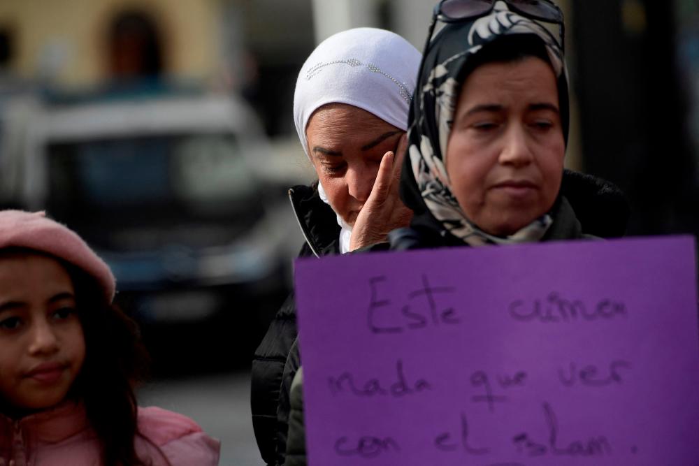 Muslim women gather in protest against an attack on church men in Alta square, in Algeciras, southern Spain, on January 26, 2023. AFPPIX