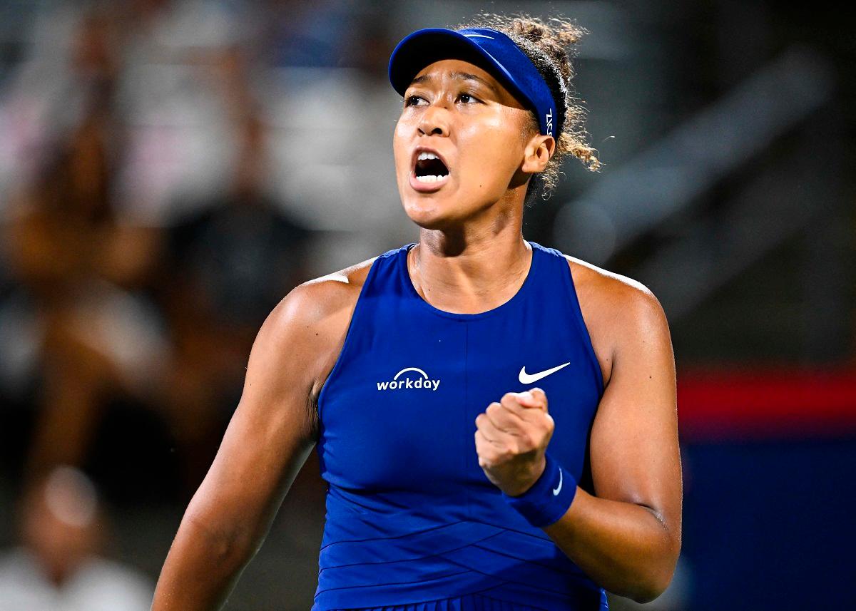 Naomi Osaka of Japan celebrates a point against Clara Tauson of Denmark during their semifinal singles women’s match on Day Eleven of the WTA 1000 National Bank Open at IGA Stadium on August 6, 2025 in Montreal, Quebec, Canada. - Minas Panagiotakis/Getty Images/AFP
