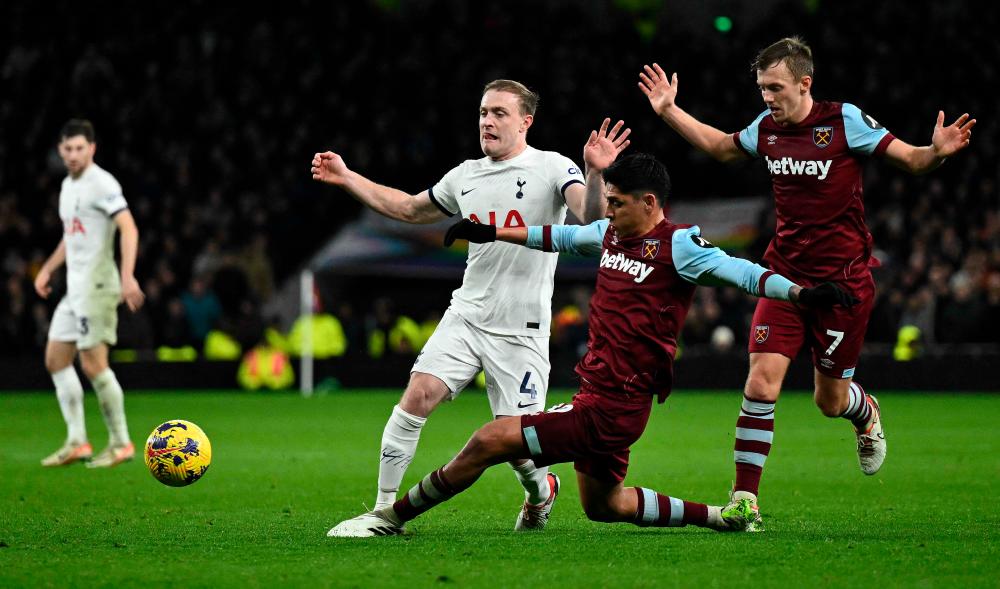West Ham’s Edson Alvarez (2nd right) challenges Tottenham’s Oliver Skipp during the English Premier League match at Tottenham Hotspur Stadium on Dec 7, 2023. – AFPPIX