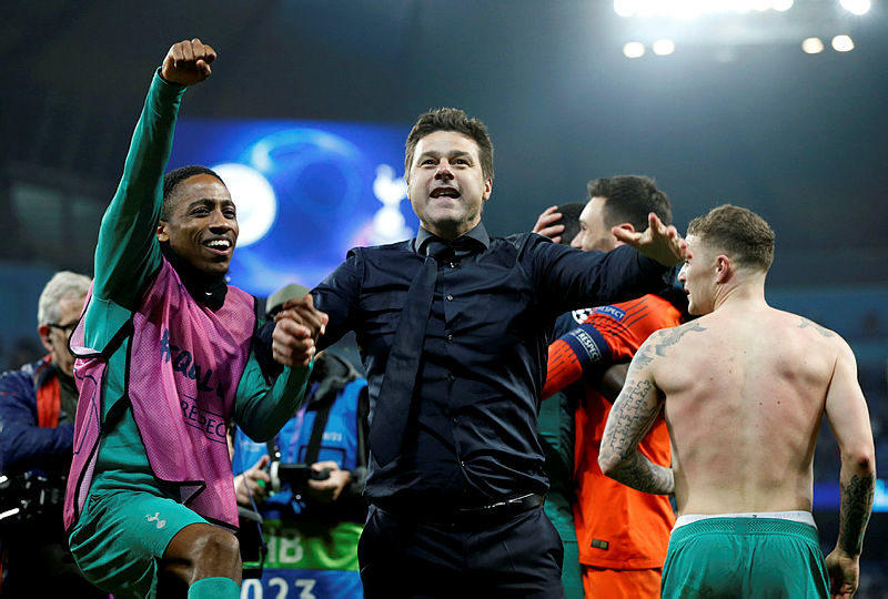 Tottenham manager Mauricio Pochettino and Tottenham’s Kyle Walker-Peters celebrate after the match. — AFP