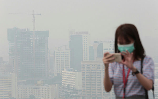 A view of the haze enveloping Kuching city at 1pm today. — Bernama