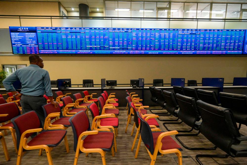 A man looks on inside Colombo Stock Exchange (CSE) in Colombo on March 21, 2023. AFPPIX