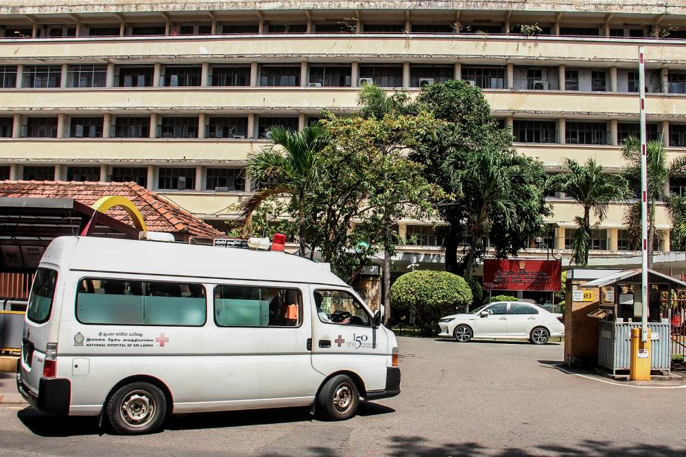 In this picture taken on July 19, 2022, an ambulance arrives at the National Hospital in Colombo. AFPPIX