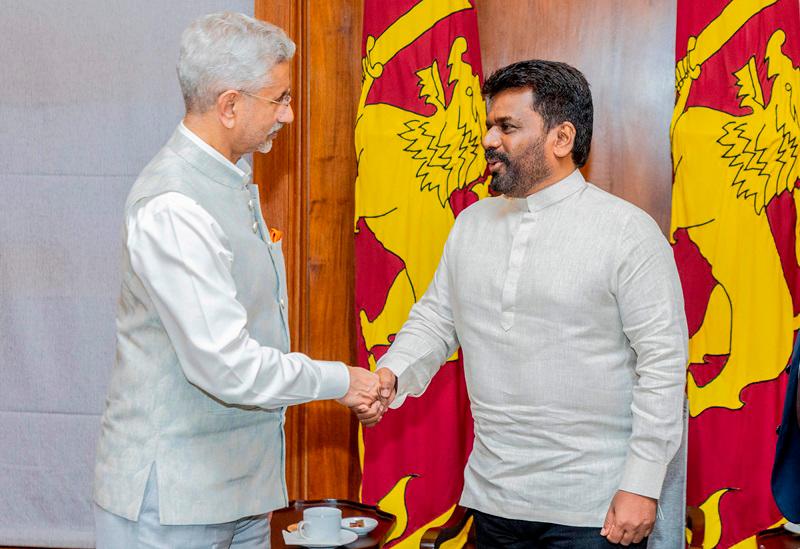 This handout photograph taken and released by the Sri Lankan Presidents's Office on October 4, 2024 shows India's External Affairs Minister S. Jaishankar (L) shaking hands with Sri Lanka's President Anura Kumara Dissanayake during a meeting in Colombo. - AFP PHOTO / Sri Lankan Presidents's Office