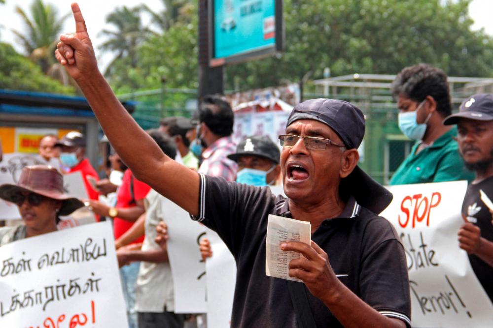 Demonstrators from the Sri Lanka Trade Union Center, take part in a protest condemning the government’s crackdown on protestors, in Colombo on August 4, 2022. AFPPIX