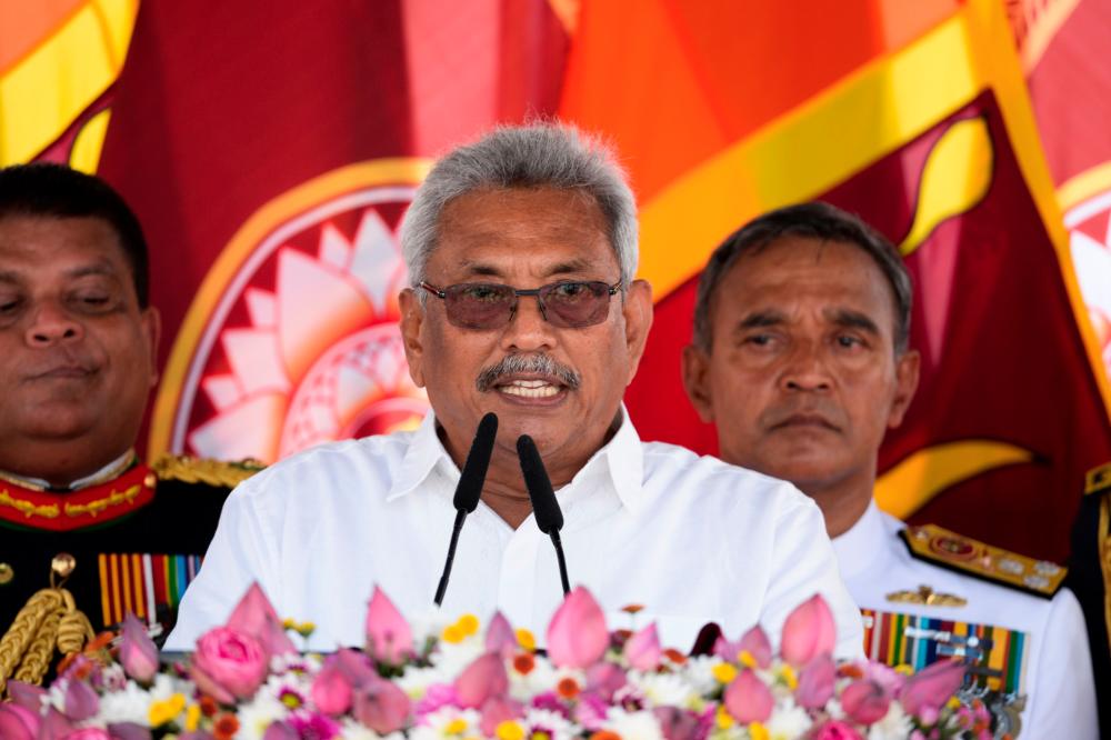 Sri Lanka's new president Gotabaya Rajapaksa (C) speaks after taking oath of office during his swearing-in ceremony at the Ruwanwelisaya temple in Anuradhapura on Nov 18. — AFP