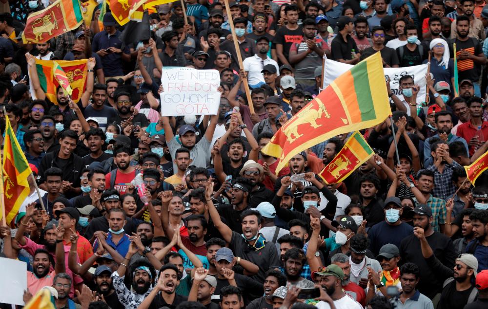 Demonstrators celebrate after entering into the Presidential Secretariat, after President Gotabaya Rajapaksa fled, amid the country's economic crisis, in Colombo, Sri Lanka July 9, 2022. REUTERSpix