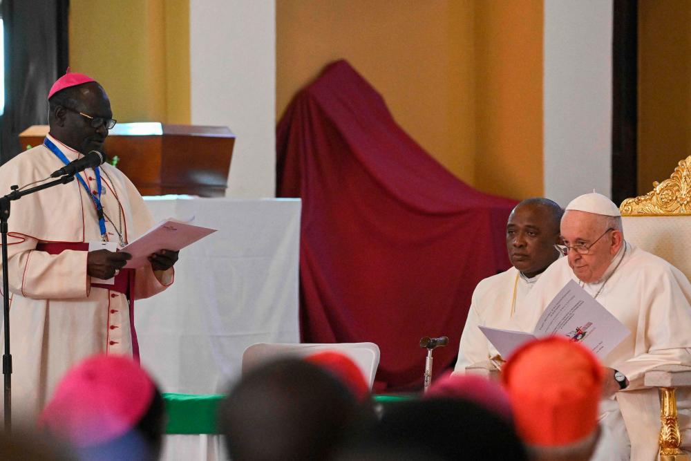 Pope Francis (R) attends a meeting with meeting with bishops, priests, deacons, consecrated persons and seminarians at the Cathedral of Saint Therese in Juba, South Sudan, on February 4, 2023. AFPPIX
