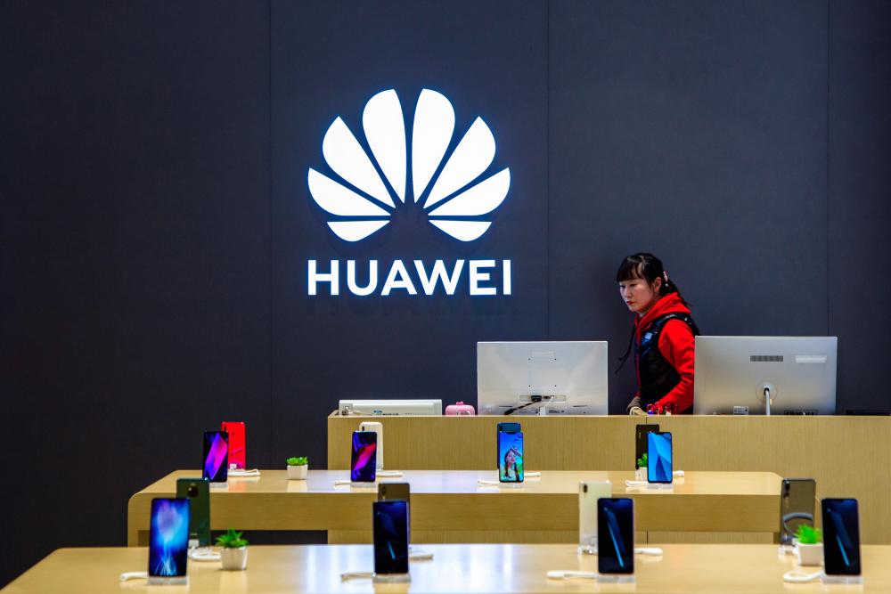 A staff member is seen inside a Huawei retail store in Shanghai, China May 8, 2019. - Reuters