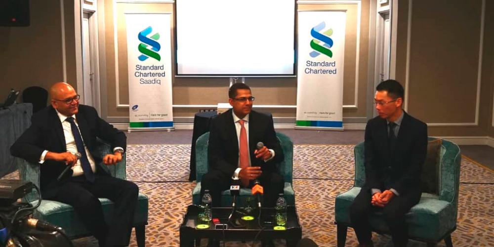 From left: Standard Chartered senior investment strategist Manish Jaradi, Standard Chartered Malaysia head of wealth management Sammeer Sharma and Chang at a press conference today.