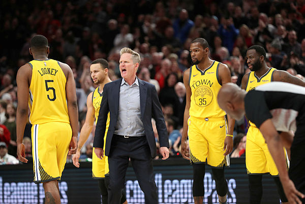 Golden State Warriors head coach Steve Kerr (C) reacts to the referee after a play with Portland Trail Blazers and gets ejected from the game in the second half at Moda Center. — Reuters