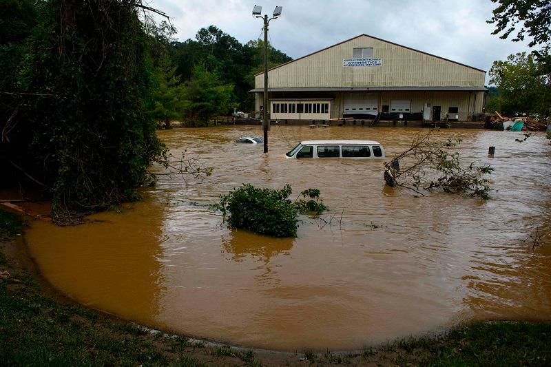 Heavy rains from Hurricane Helene caused record flooding and damage on September 28, 2024 in Asheville, North Carolina. Hurricane Helene made landfall in Florida's Big Bend on Thursday night with winds up to 140 mph and storm surges that killed at least 42 people in several states. - Melissa Sue Gerrits/Getty Images/AFP