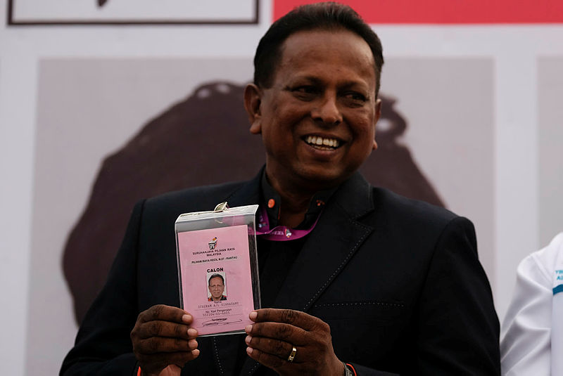 Pakatan Harapan candidate for the Rantau by-election, Dr S. Streram shows his candidacy card after successfully filing his nomination, on March 30, 2019. — Bernama