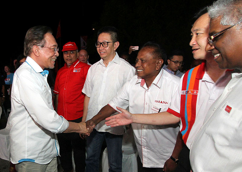 PKR president Datuk Seri Anwar Ibrahim is greeted by hus party’s candidate for the Rantau by-election Dr S Strram (3rd R), on the campaign trail, on April 6, 2019. — Bernama