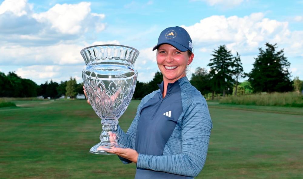 Sweden’s Linnea Strom pose for photos after winning the ShopRite LPGA Classic presented by Acer. – LPGA Tour/Getty Images