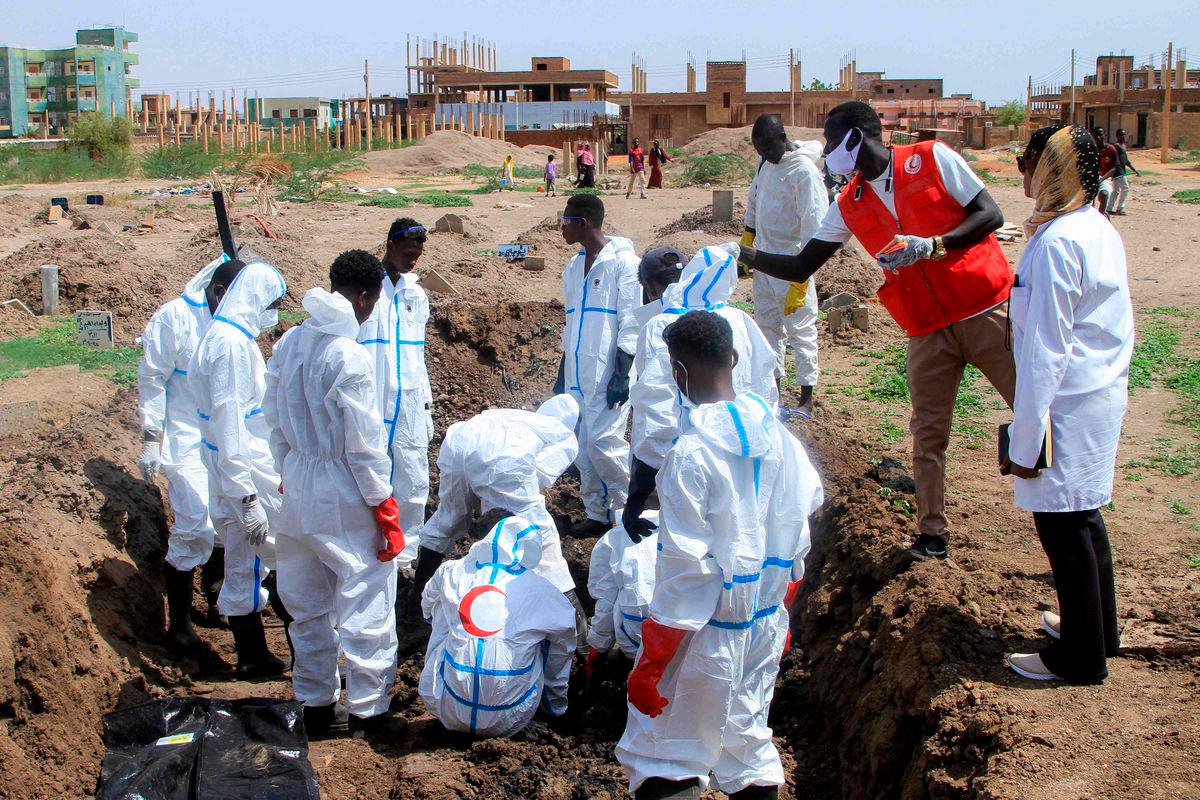 Members of the Sudanese Red Crescent and forensic experts exhume the remains of people from makeshift graves for reburial in the local cemetery in Khartoum’s southern suburb of al-Azhari on August 2, 2025 after the dead were buried in a rush when the area was under control of the Rapid Support Forces (RSF) paramilitaries. AFPPix