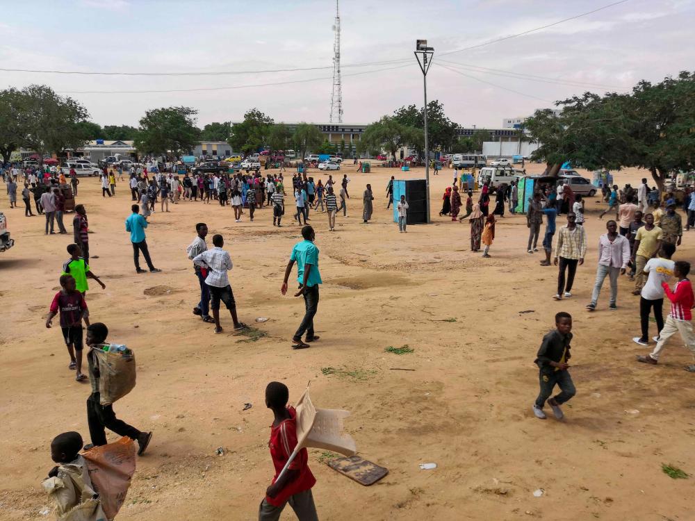 Sudanese protesters gather in the central Sudanese city of Al-Obeid on July 31, 2019, two days after five pupils were shot dead for protesting against a shortage of bread. Hundreds of protesters marched through a central Sudanese city on Wednesday to condemn the killing of five school children at a rally against a growing shortage of bread and fuel in the city, as the trial of ousted leader Omar al-Bashir on corruption charges was set for August. It was the tripling of prices of bread that had triggered the initial protests against now ousted leader Omar al-Bashir in December. — AFP