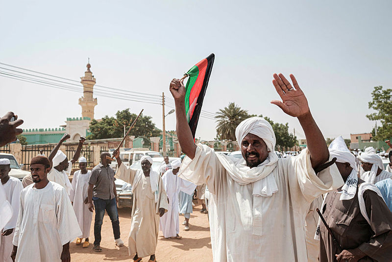 People react as they leave a mosque where Sudanese top opposition leader and former premier attended Friday prayers in the capital Khartoum’s twin city Omdurman on June 14, 2019. Sudan’s veteran opposition leader Sadiq al-Mahdi called today for an ‘objective’ international investigation into last week’s deadly crackdown on protesters, after the ruling military council rejected such a probe. — AFP