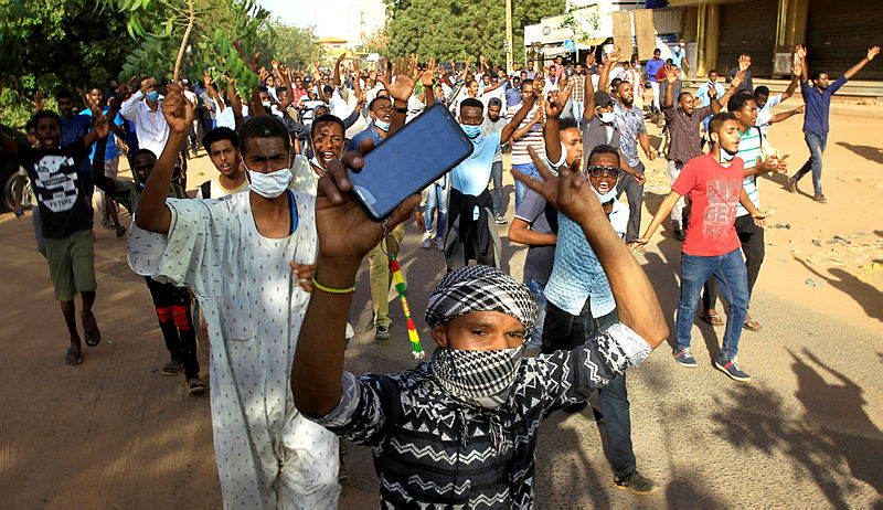udanese demonstrators chant slogans as they march along the street during anti-government protests in Khartoum, Sudan Dec 25, 2018. — Reuters