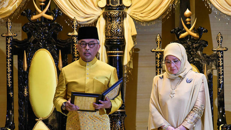 Al-Sultan Abdullah Ri’ayatuddin Al-Mustafa Billah Shah Ibni Sultan Haji Ahmad Shah Al-Musta’in Billah (L) following his proclamation as the Sultan of Pahang, on Jan 15. — AFP