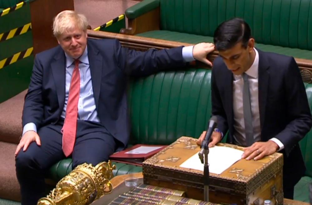 Video grab from footage broadcast by the UK Parliament's Parliamentary Recording Unit shows Prime Minister Boris Johnson listening as Sunak delivers his Summer Economic Statement in the House of Commons in London today. – AFP/PRU PIX