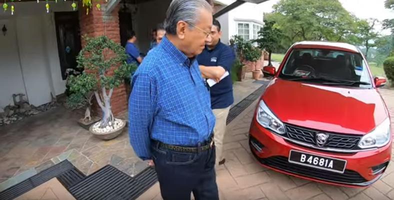 A screen grab of the video showing Tun Dr Mahathir Mohamad with the new Proton Saga. — Pix courtesy of Chedet Official Youtube channel