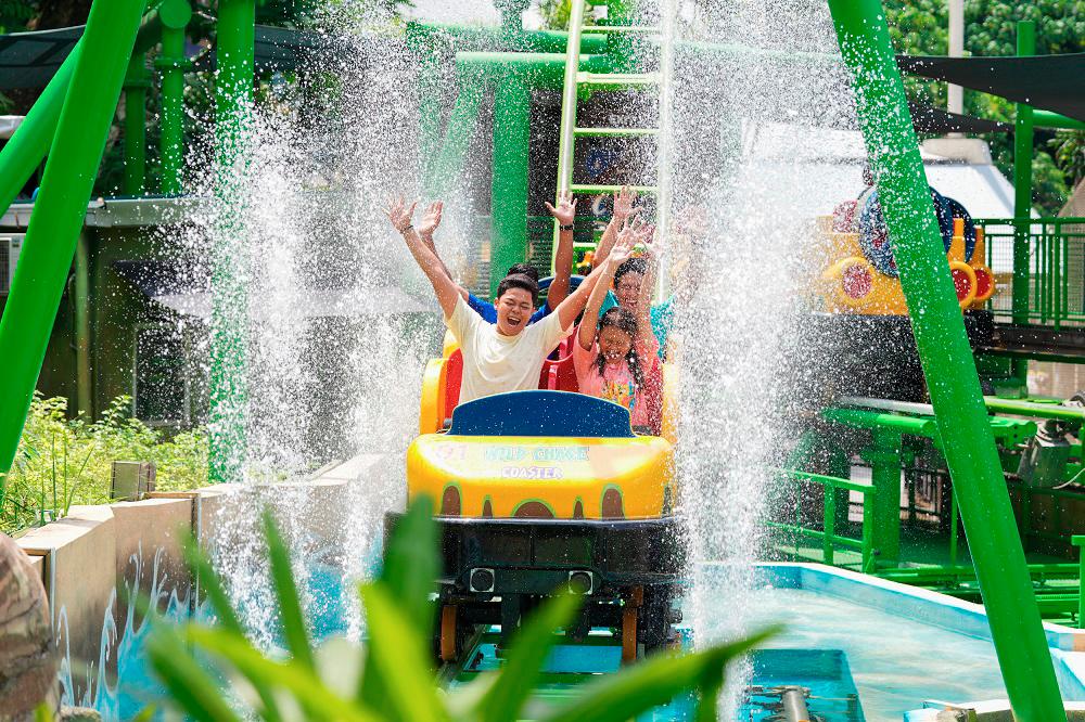 The Wild Chase Water Coaster offers a blend of coaster thrills and splashing fun in a lush tropical setting.