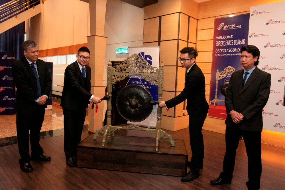 From left: Supergenics Bhd research &amp; development manager Chan Wai Mun, Tan, executive director Tan Pin Yuan and independent non-executive director Ng Fun Kim at the listing ceremony