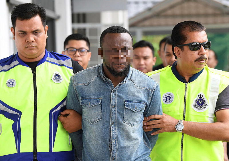 The suspect being led out of the Sepang magistrate’s court, on May 24, 2019. — Bernama