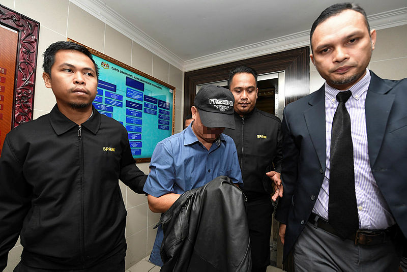 The accused is led out of the Kuala Terengganu magistrate’s court, on Jan 21, 2019. — Bernama