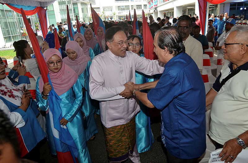 Datuk Seri Anwar Ibrahim is greeted by guests at the opening of the Penang Wisma PKR building at the One World residences in Bayan Baru, on June 30, 2019. — Bernama