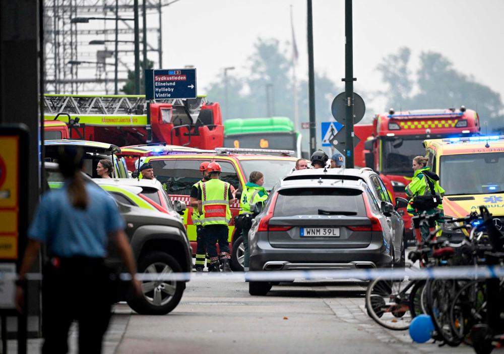 Police secures the area after two persons have been injured in a shooting at Emporia Shopping Center in Malmo, Sweden, on August 19, 2022. AFPPIX