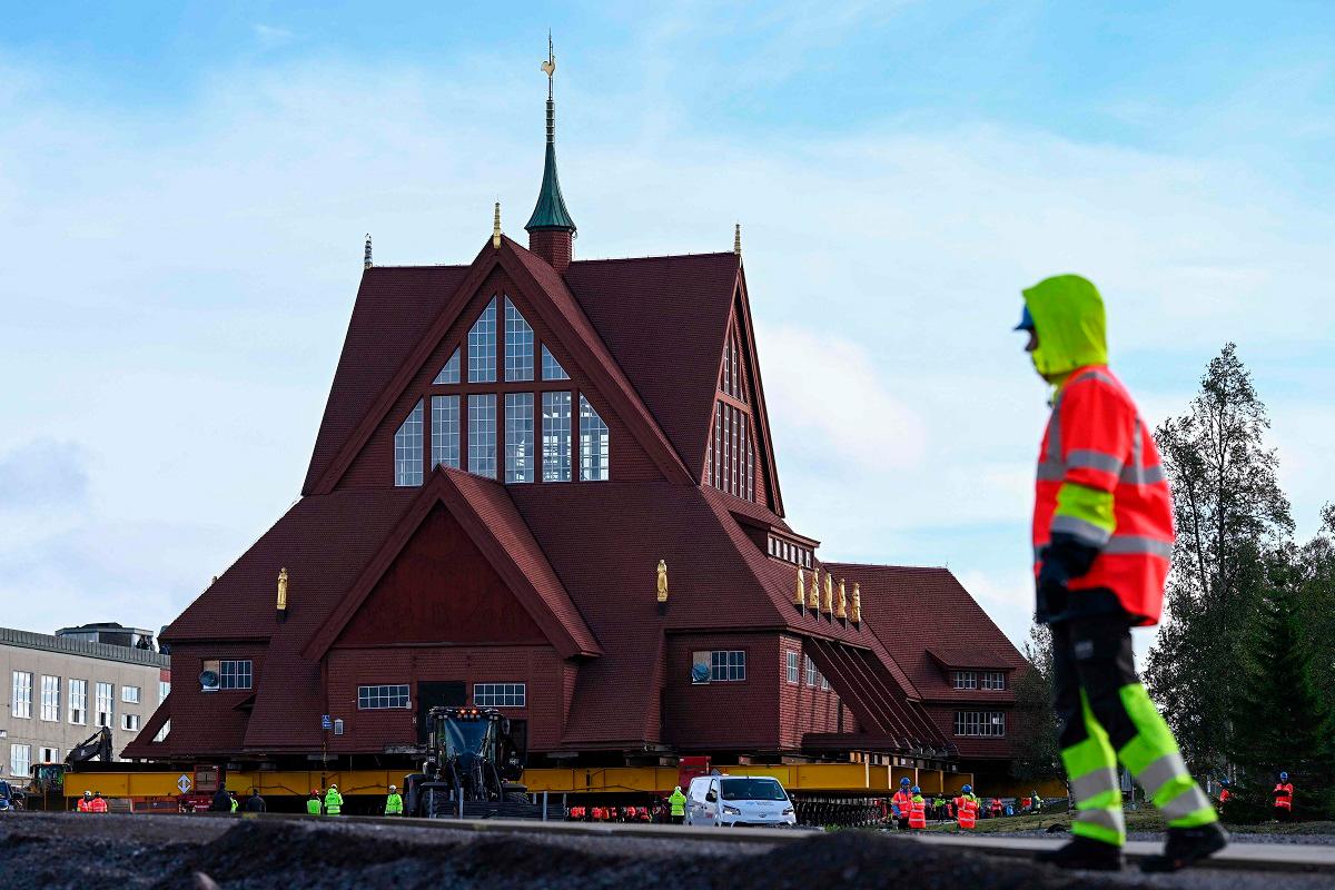 Workers prepare the moving of the wooden Kiruna Church, in Kiruna, Sweden on August 19, 2025. The church is being moved five kilometers to the new center of Kiruna due to the expansion of the iron ore mine. - Jonathan Nackstrand / AFP