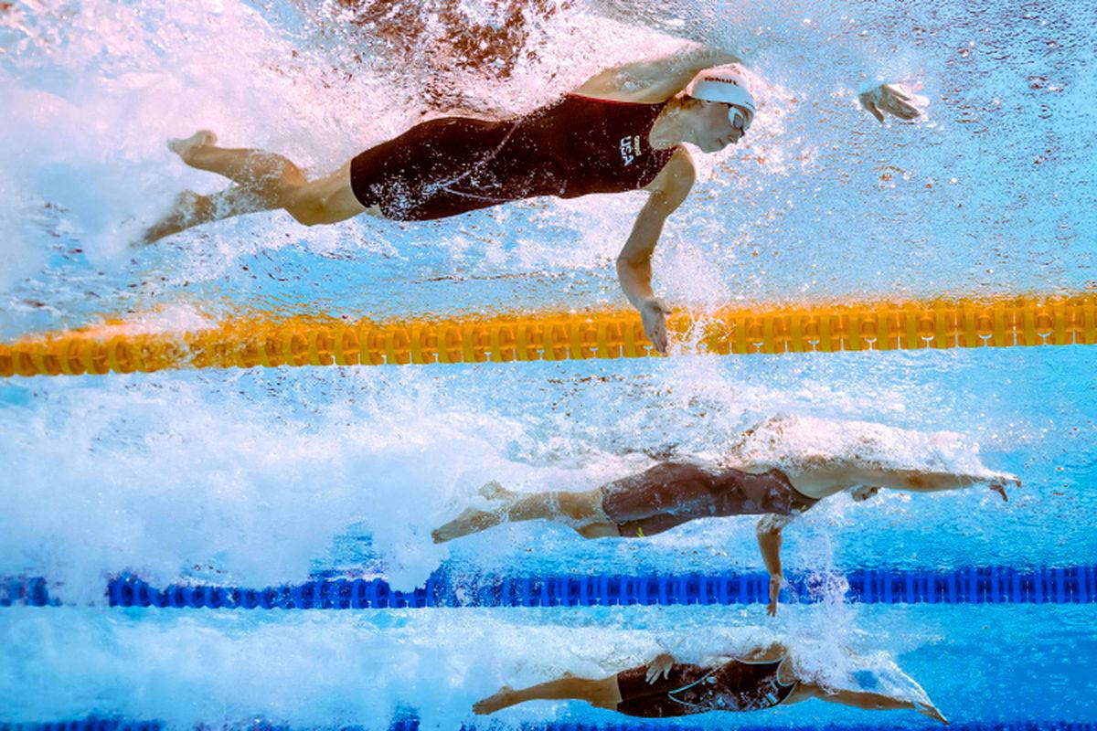 An underwater view shows USA’s Gretchen Walsh (top) as she competes in a heat of the women's 50m freestyle swimming event during the 2025 World Aquatics Championships in Singapore on August 2, 2025. - AFPPIX