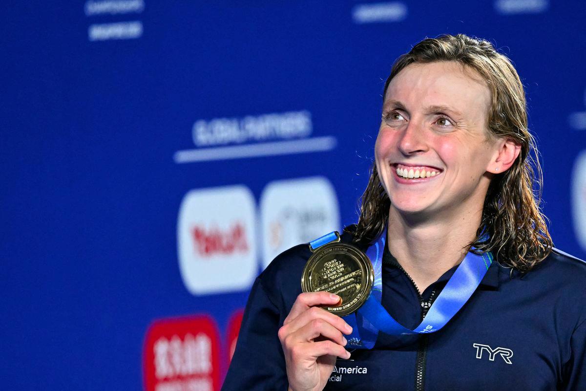 Gold medallist US' swimmer Katie Ledecky celebrates on the podium of the women's 800m freestyle swimming event during the 2025 World Aquatics Championships in Singapore on August 2, 2025. - AFPPIX