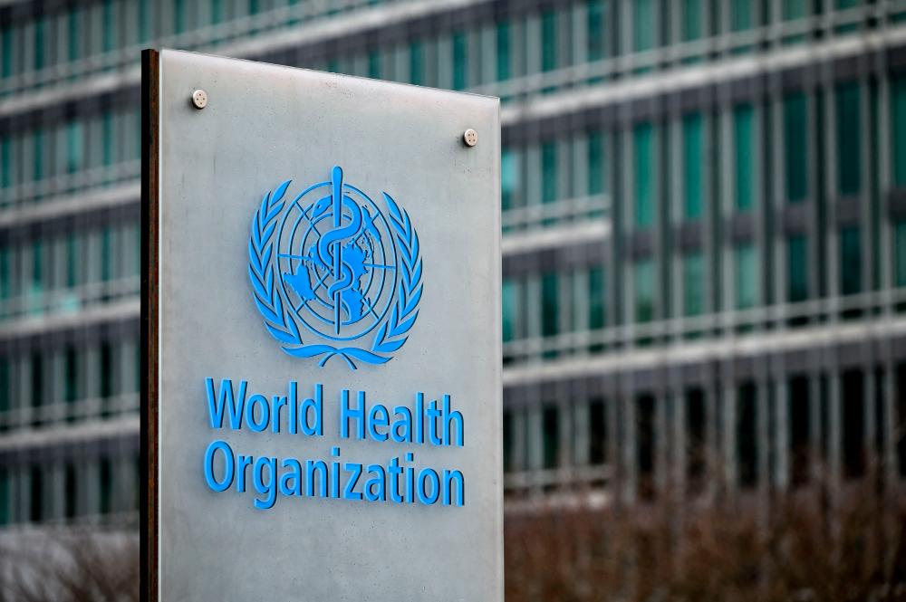 This photograph taken on December 2, 2021, shows a sign of the the World Health Organization (WHO) is seen next to theirs headquarters, in Geneva. The WHO has issued stern warnings on the dangers of vaccination apathy and the European Union put mandatory jabs on the table as the United States registered its first case of the fast-spreading Omicron strain of the coronavirus. AFPpix