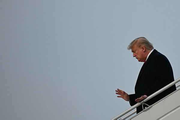 Trump arrives in Davos hours before impeachment trial reopens