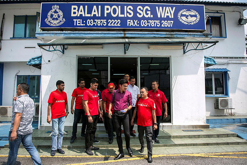 Youth and Sports Minister Syed Saddiq Syed Abdul Rahman comes out of the Sungai Way police station after lodging a report. — Bernama