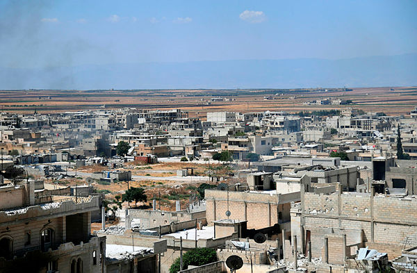 A handout picture released by the official Syrian Arab News Agency (SANA) on Aug 23, shows smoke rising in the strategic town of Khan Sheikhun after government forces took control as jihadists and allied rebels withdrew from the area. — AFP