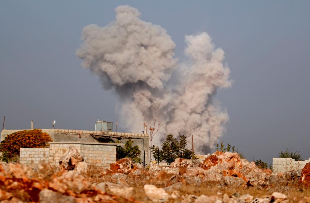 Smoke billows following airstrikes by pro-government forces on the village of Kafr Nabl, in Syria's southern Idlib province on November 13, 2019. - AFP