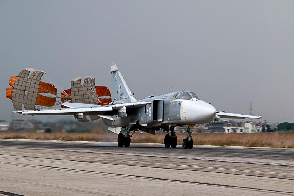 In this file photo taken on December 16, 2015, a Russian Sukhoi Su-24 attack aircraft lands at the Russian Hmeimim military base in Latakia province, in the northwest of Syria. - AFP