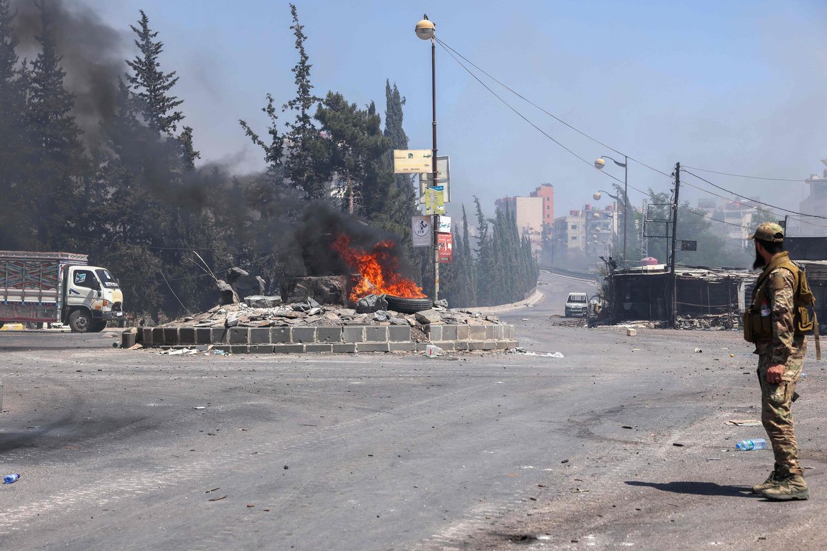 Tribal and bedouin fighters deploy amid clashes with Druze gunmen in the predominantly Druze city of Sweida in southern Syria on July 19, 2025. - AFP