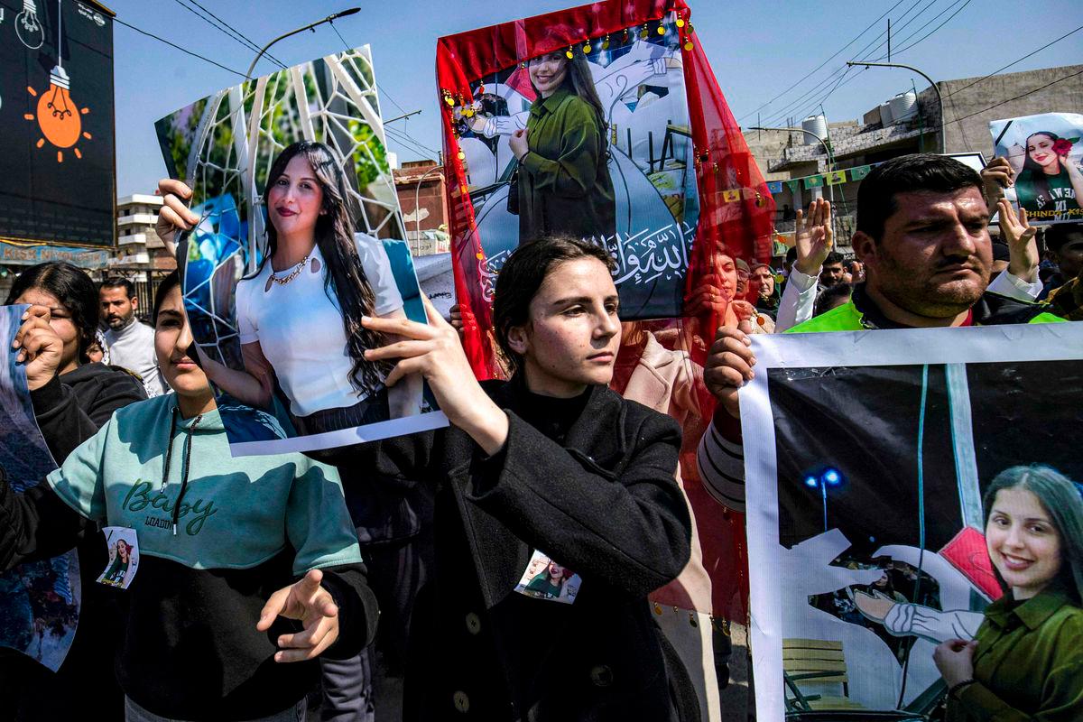 People gather for a mass demonstration in Syria’s northeastern city of Qamishli on March 11, 2025 protesting against a recent wave of sectarian violence targeting Syria’s Alawite minority in the west of the country along the Mediterranean sea coast. (Photo by Delil SOULEIMAN / AFP)