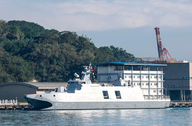 A Taiwanese Navy ship sails in the harbour in Keelung on December 11, 2024. Taiwan said on December 11 it had detected 53 Chinese military aircraft and 19 ships near the island in the past 24 hours, as Beijing holds its biggest maritime mobilisation in years. - I-Hwa CHENG / AFP