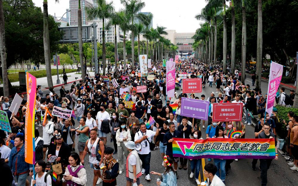 People take part in Taiwan's annual LGBTQ Pride Parade, set off from Taipei City Hall in Taipei on October 28, 2023. AFPPIX