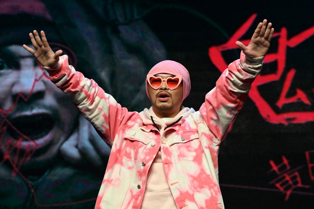 Malaysian rapper Wee Meng Chee, known by his stage name Namewee, gestures during a press conference in Taipei on November 15, 2021. AFPPIX