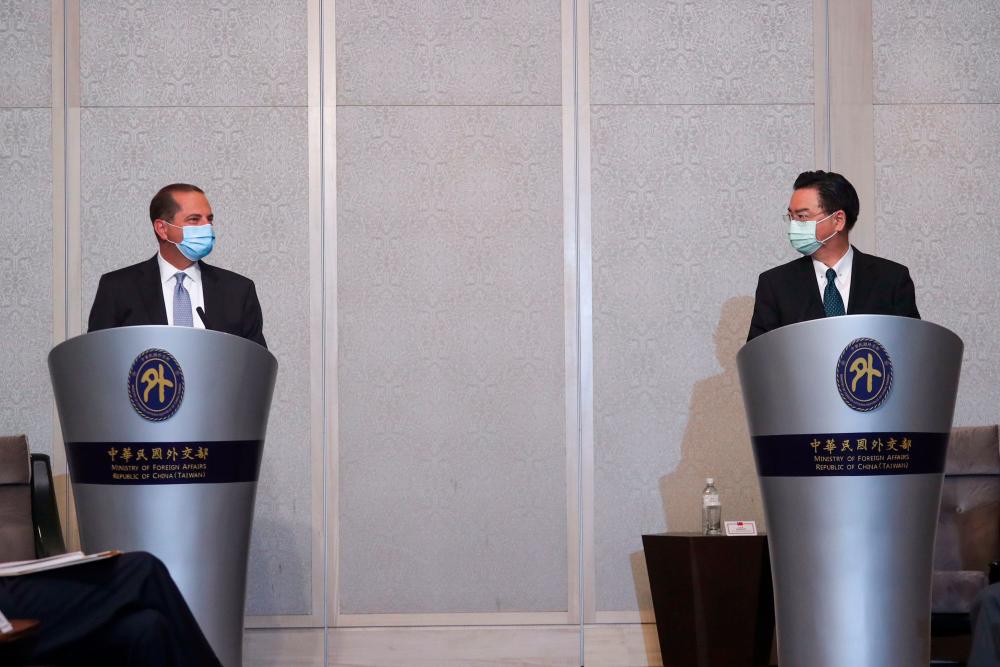 US Secretary of Health and Human Services Alex Azar (L) speaks while meeting with Taiwan’s Foreign Minister Joseph Wu (R) at a local hotel in Taipei on August 11, 2020. — AFP