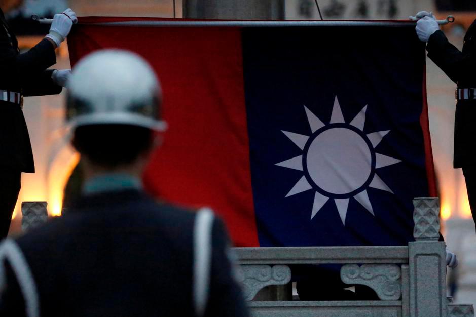 Honor guards perform Taiwan national flag lowering ceremony at Liberty Square, as the spread of the coronavirus disease (Covid-19) continues, in Taipei, Taiwan, April 1, 2020. — Reuters